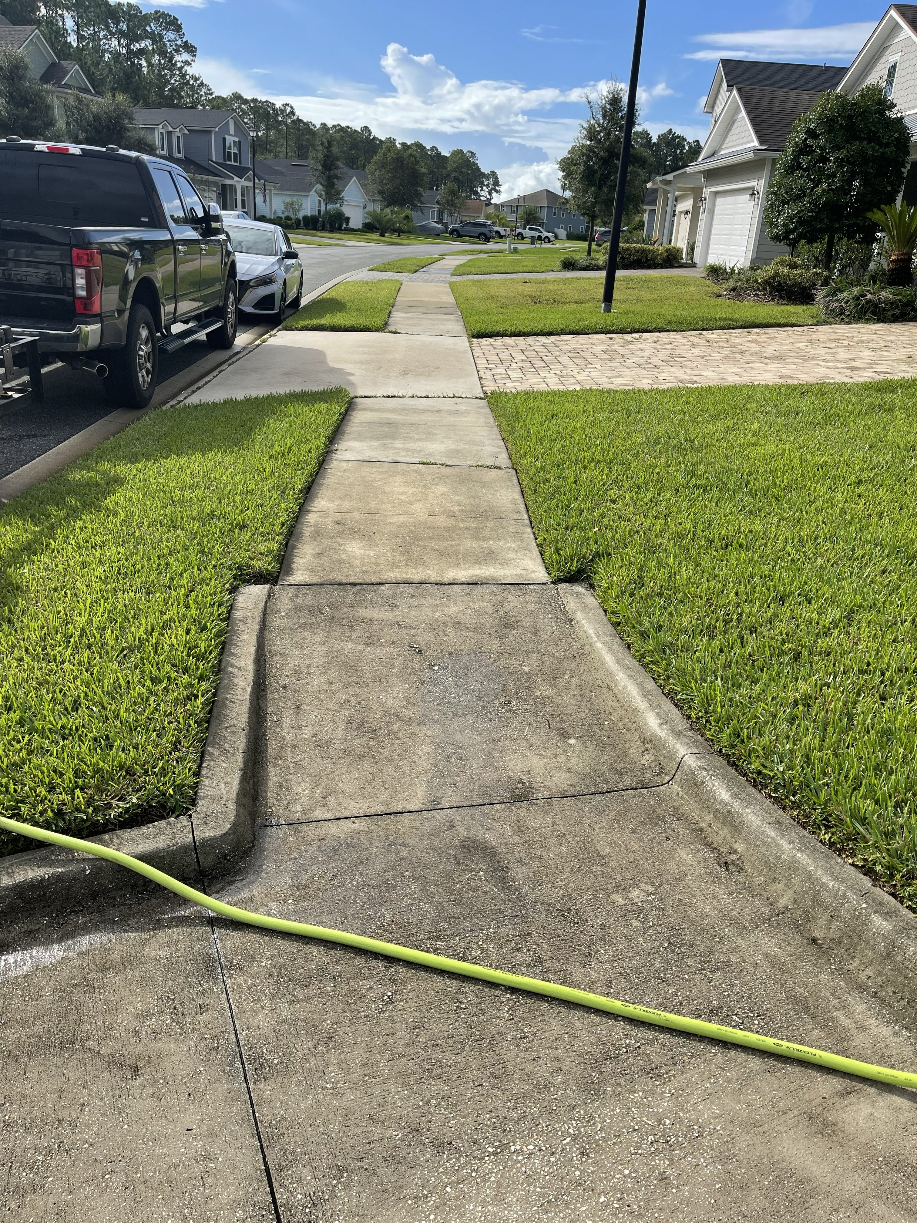 Sidewalk and concrete before cleaning